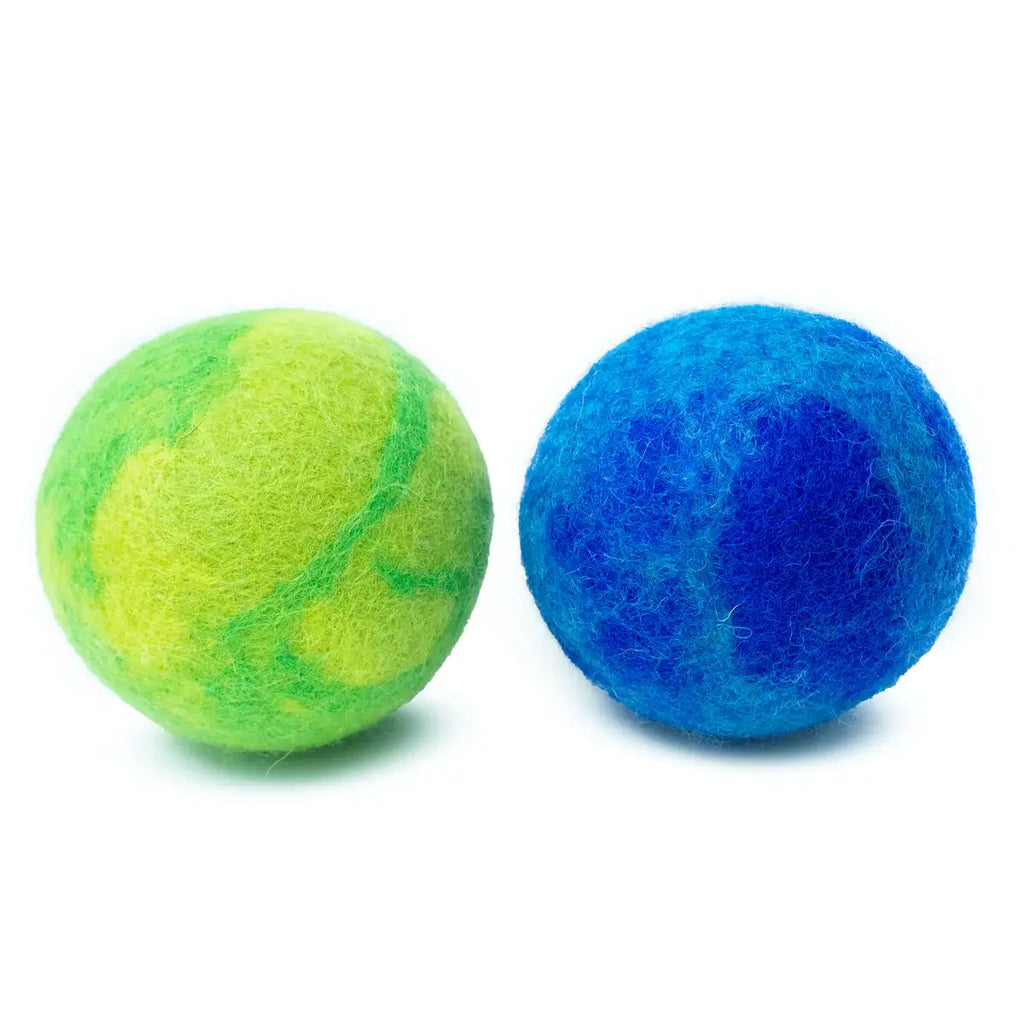Two felted wool balls, one green and one blue, on a white background