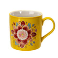 Yellow mug with a colorful floral design on a white background