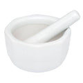 White ceramic mortar and pestle on a white background