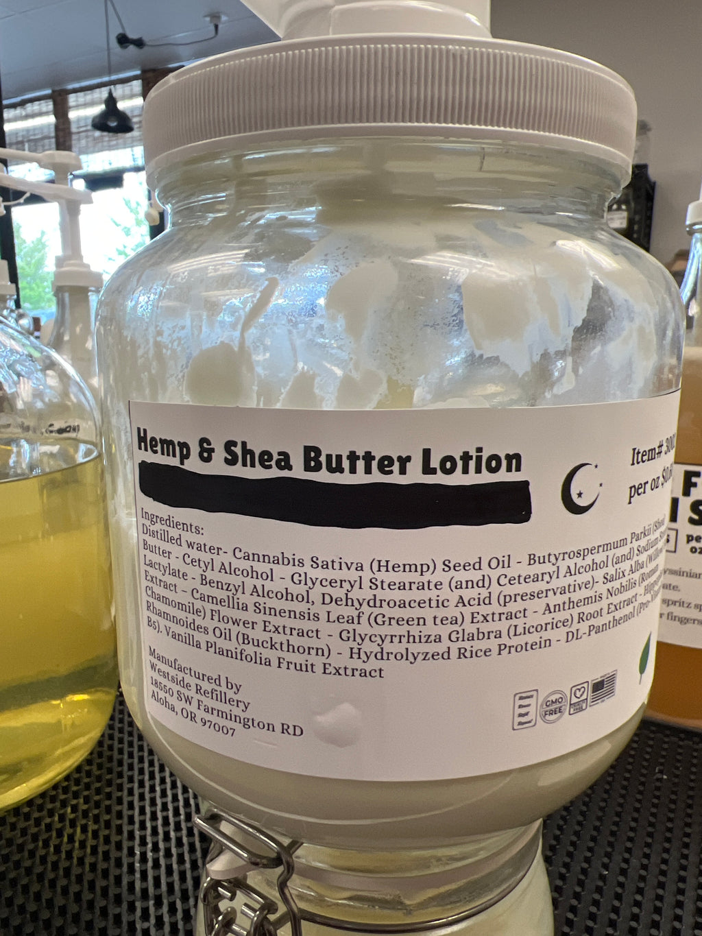 Jar of Hemp & Shea Butter Lotion with a label on a blurred background