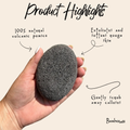 Hand holding a volcanic pumice stone with product highlights text on a beige background