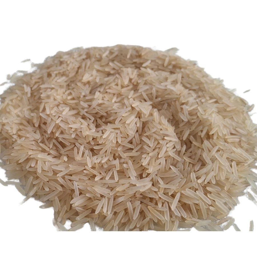 Close-up of a pile of uncooked brown rice on a white background