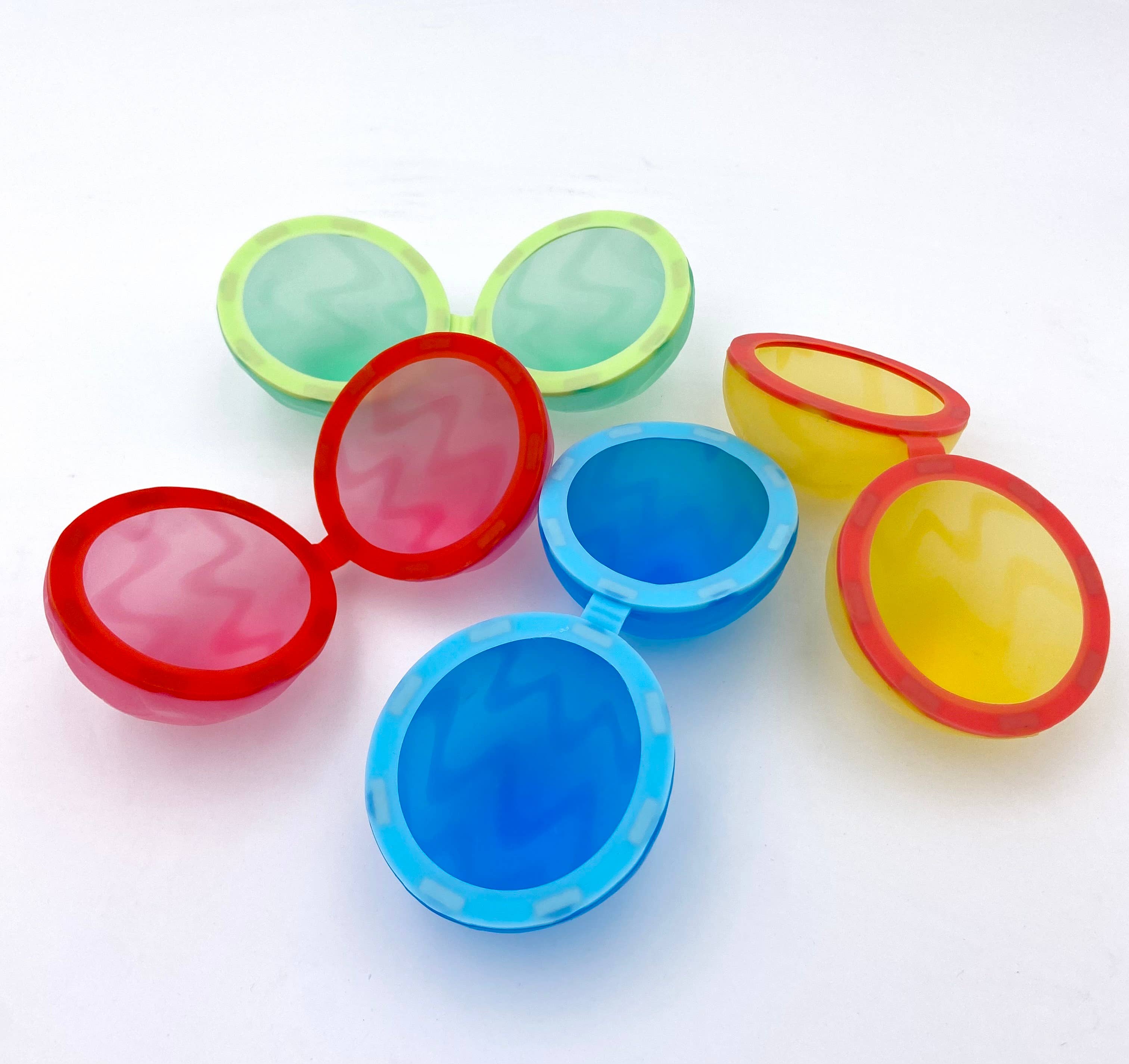 Open colorful reusable water balloons on a white background