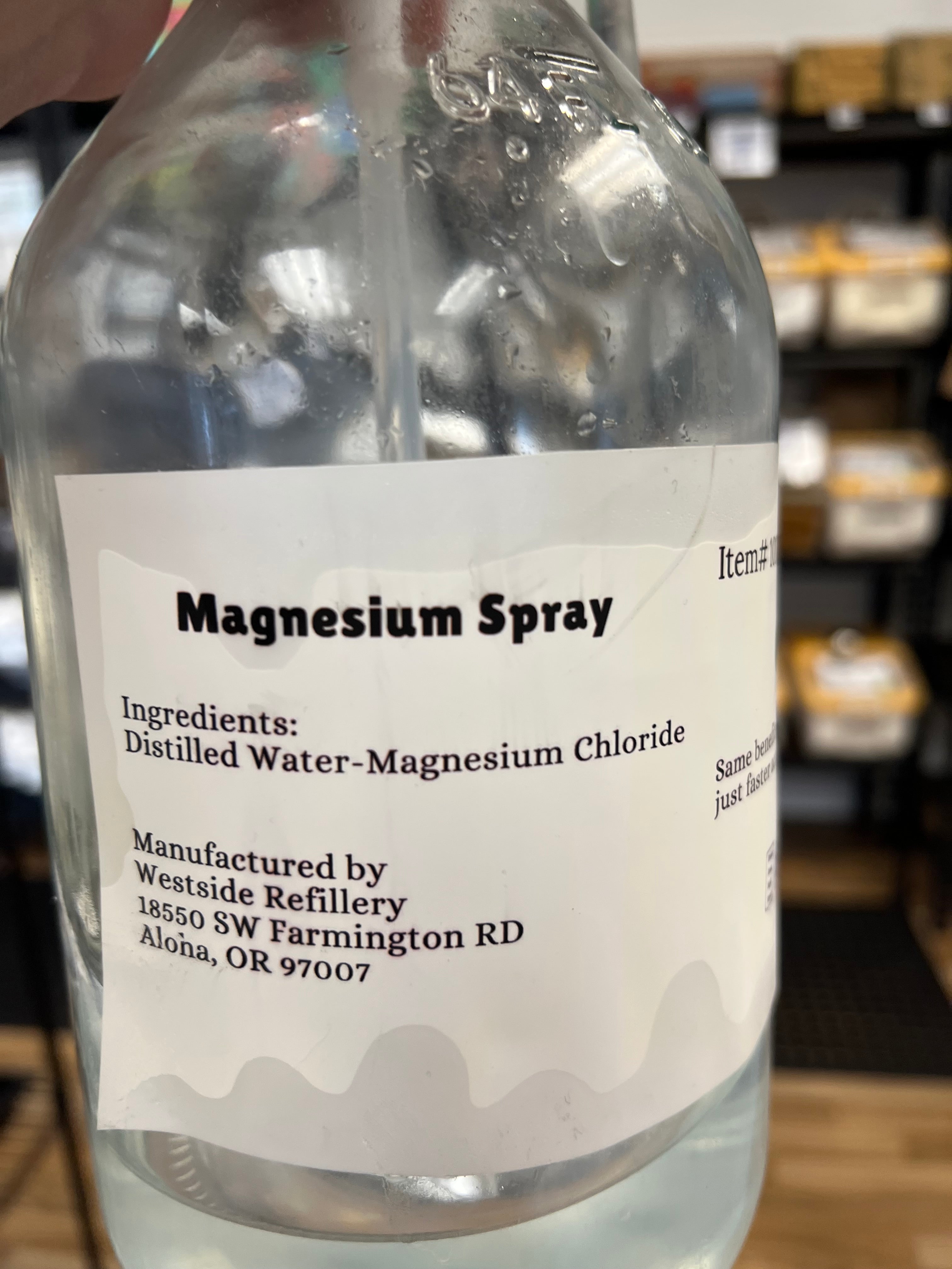 Bottle of magnesium spray with a label on a blurred background