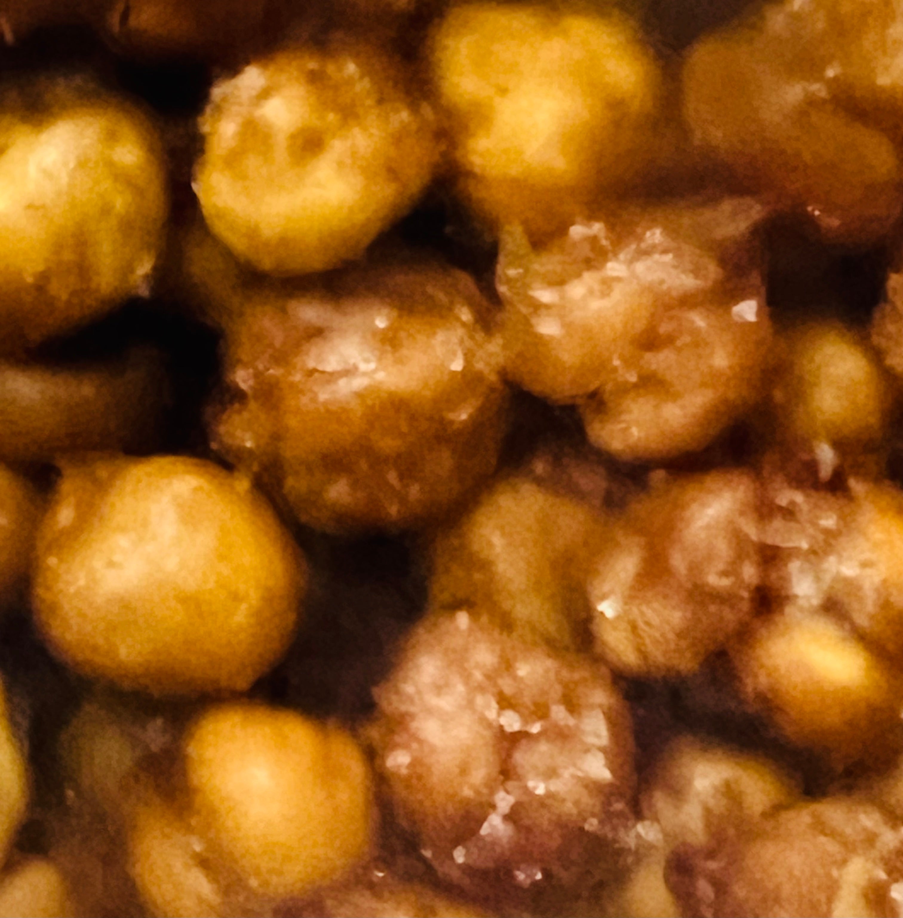 Close-up of roasted chickpeas with a brownish color.
