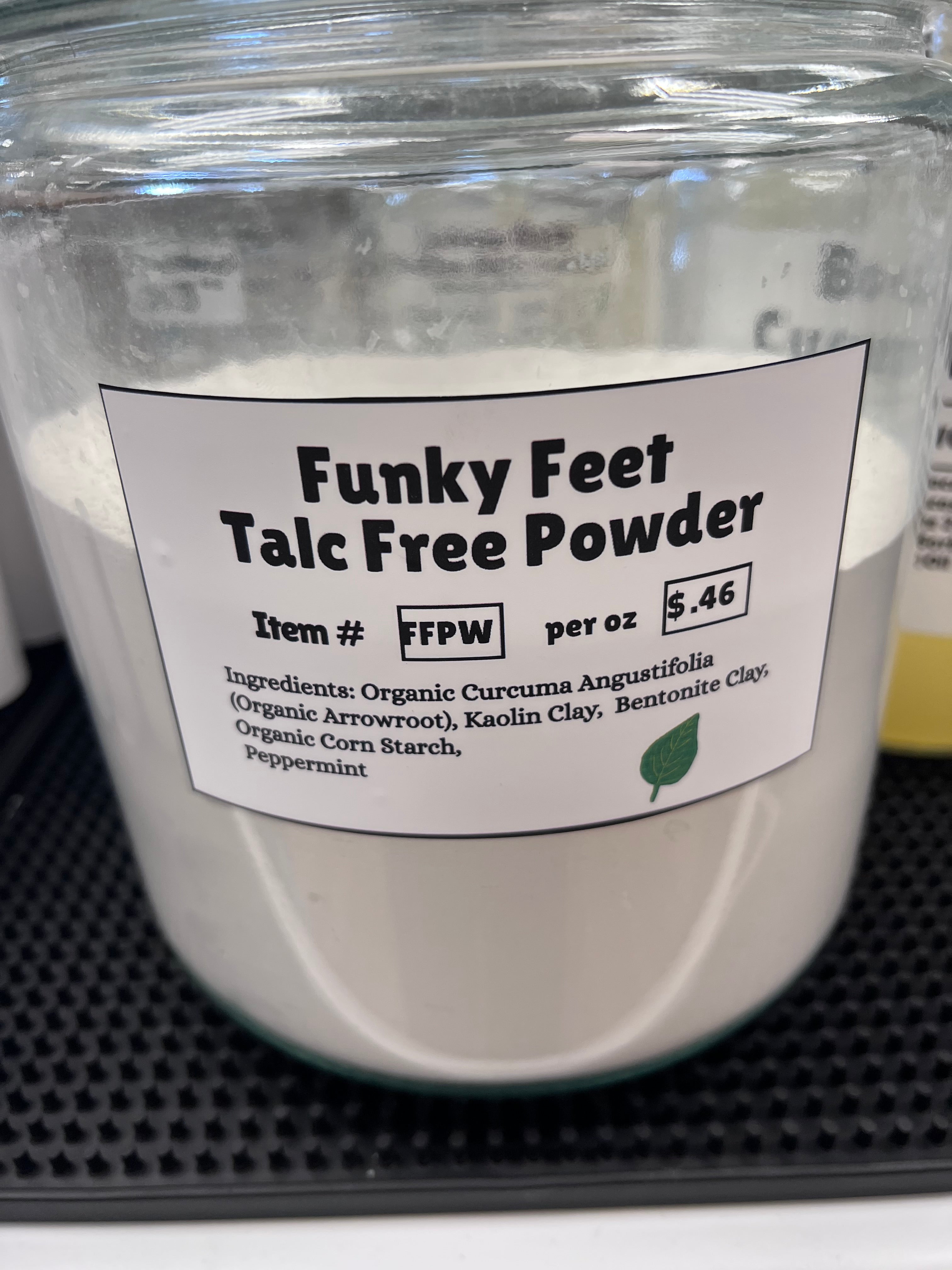 Funky Feet Talc Free Powder container with label on a black background