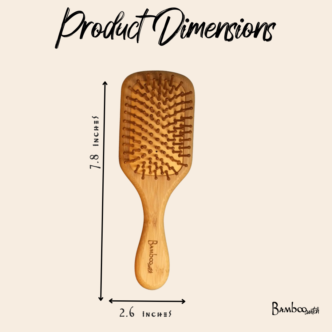 Wooden hairbrush with dimensions labeled on a beige background