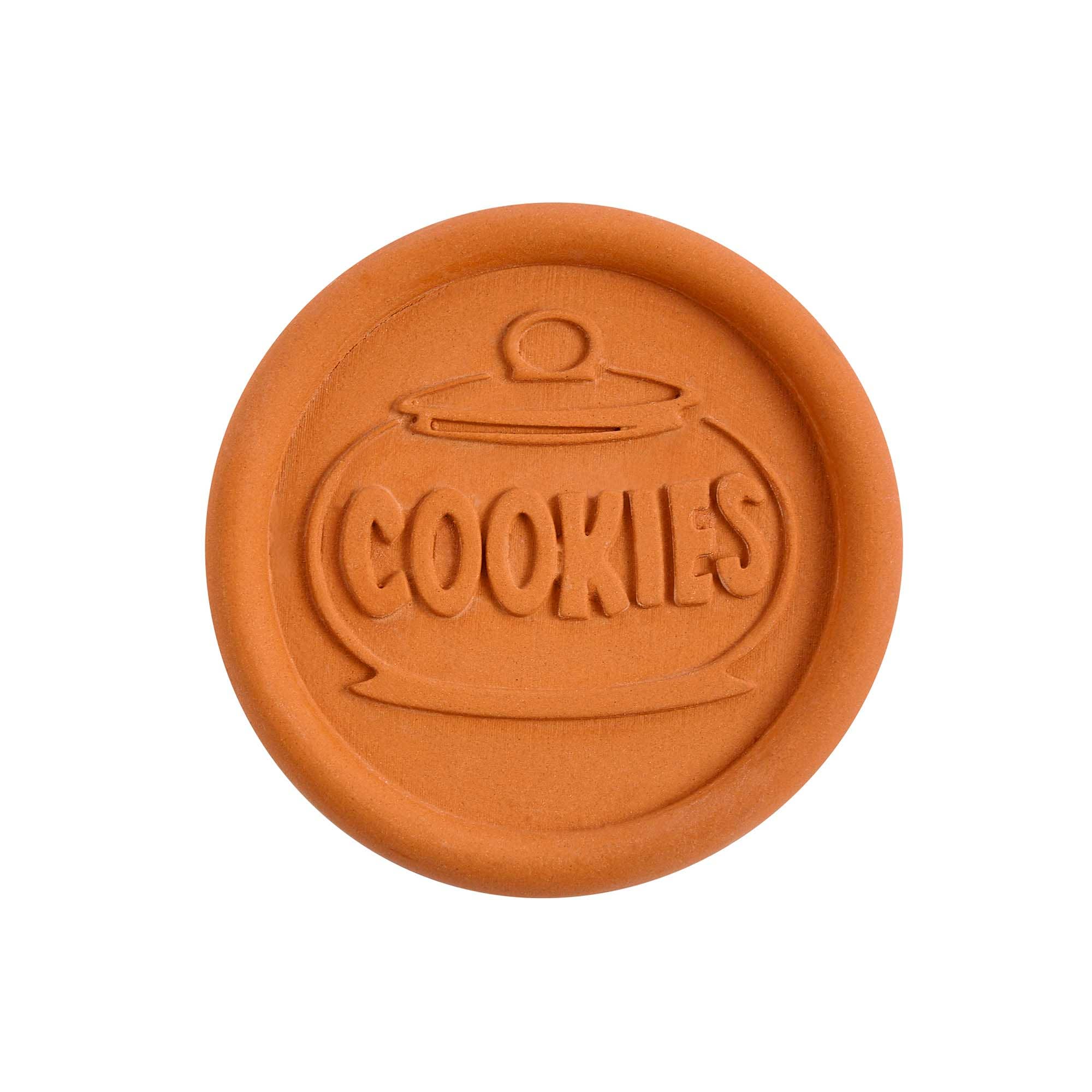 Round terracotta-colored object with 'COOKIES' embossed on it, on a white background
