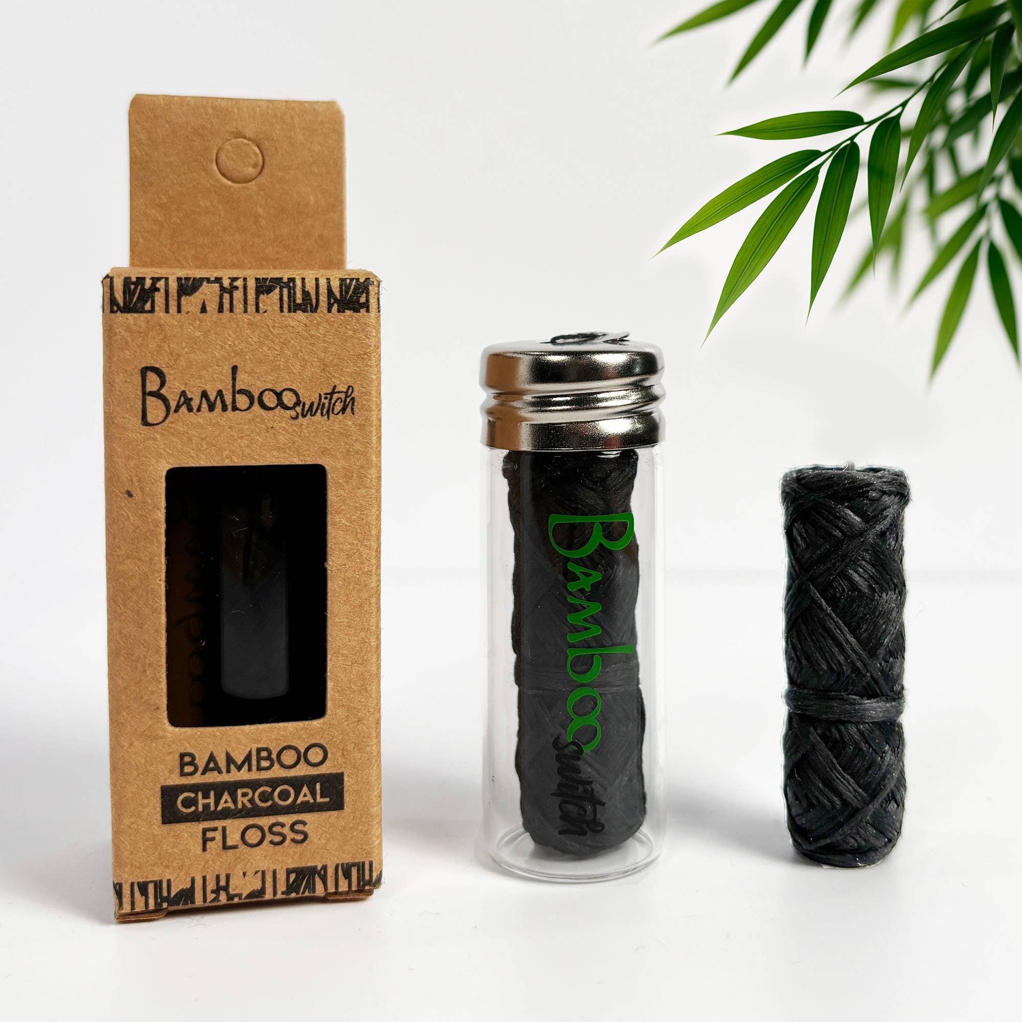 Bamboo Charcoal Floss set with packaging and floss on a white background