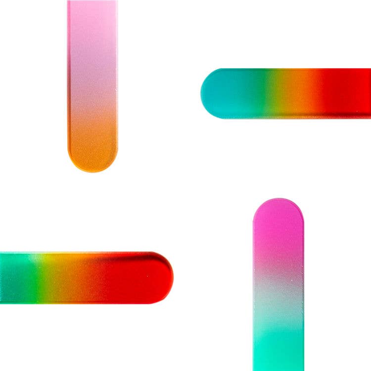 Colorful glass nail file with gradient patterns on a white background