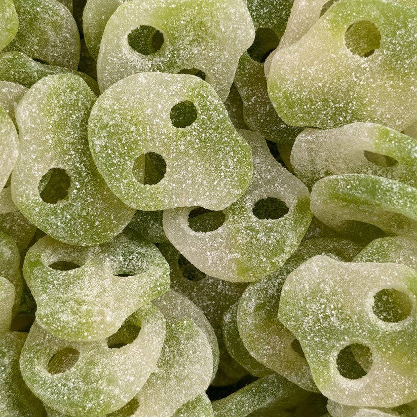 Close-up of green gummy candy with a textured surface