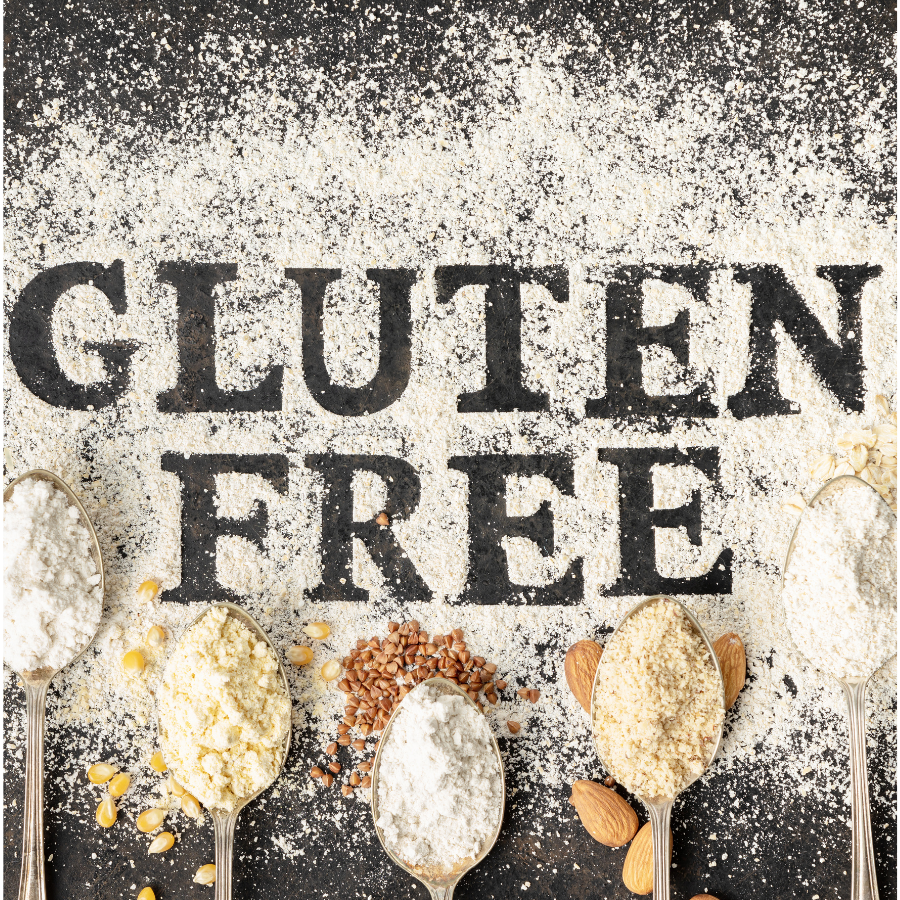 Spices and grains with 'GLUTEN FREE' text on a black background