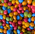 Assorted colorful round candies in a pile