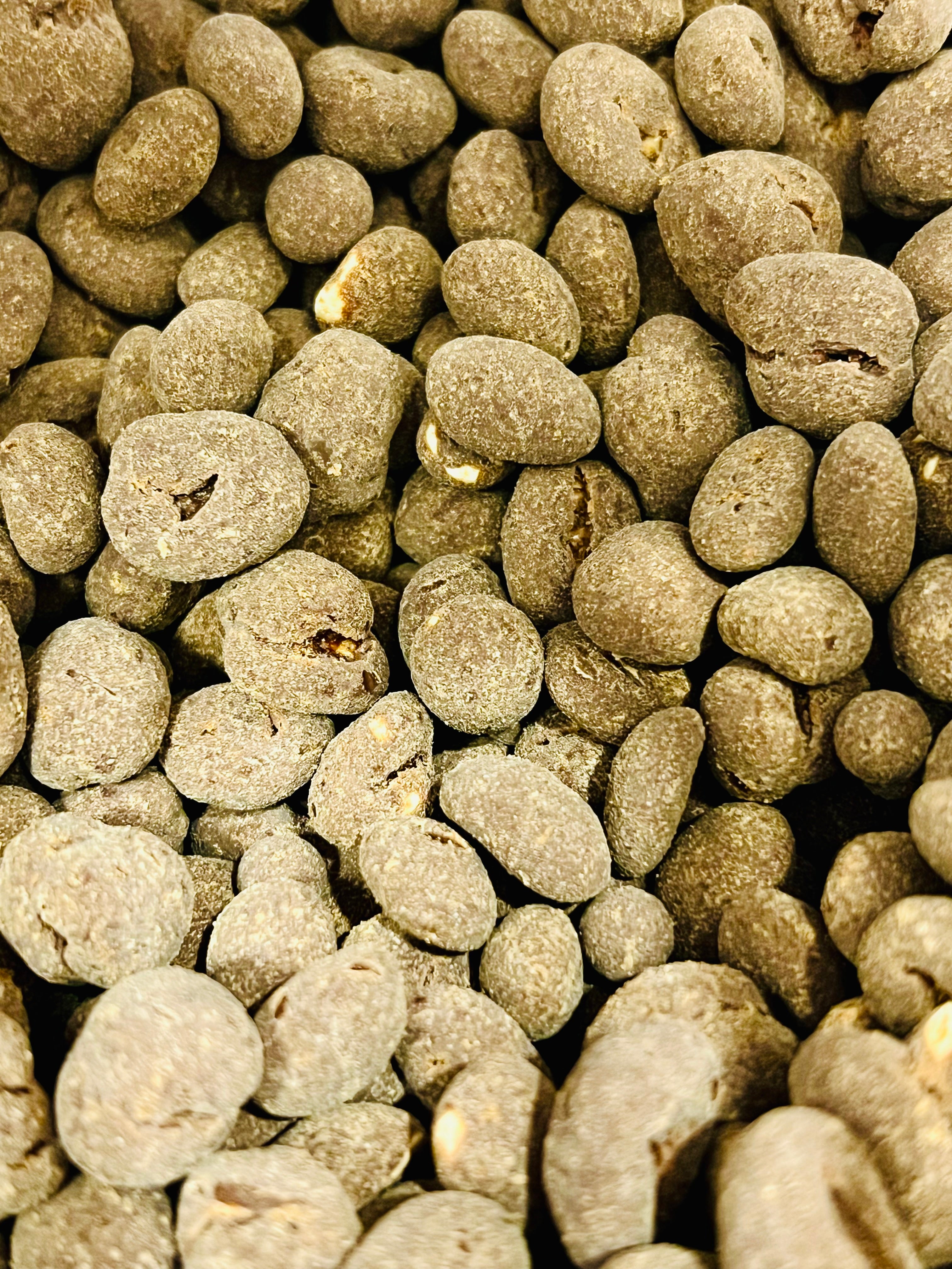 Close-up of carob coved peanuts. 