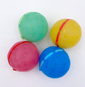 Four colorful reusable water balloons  on a white background
