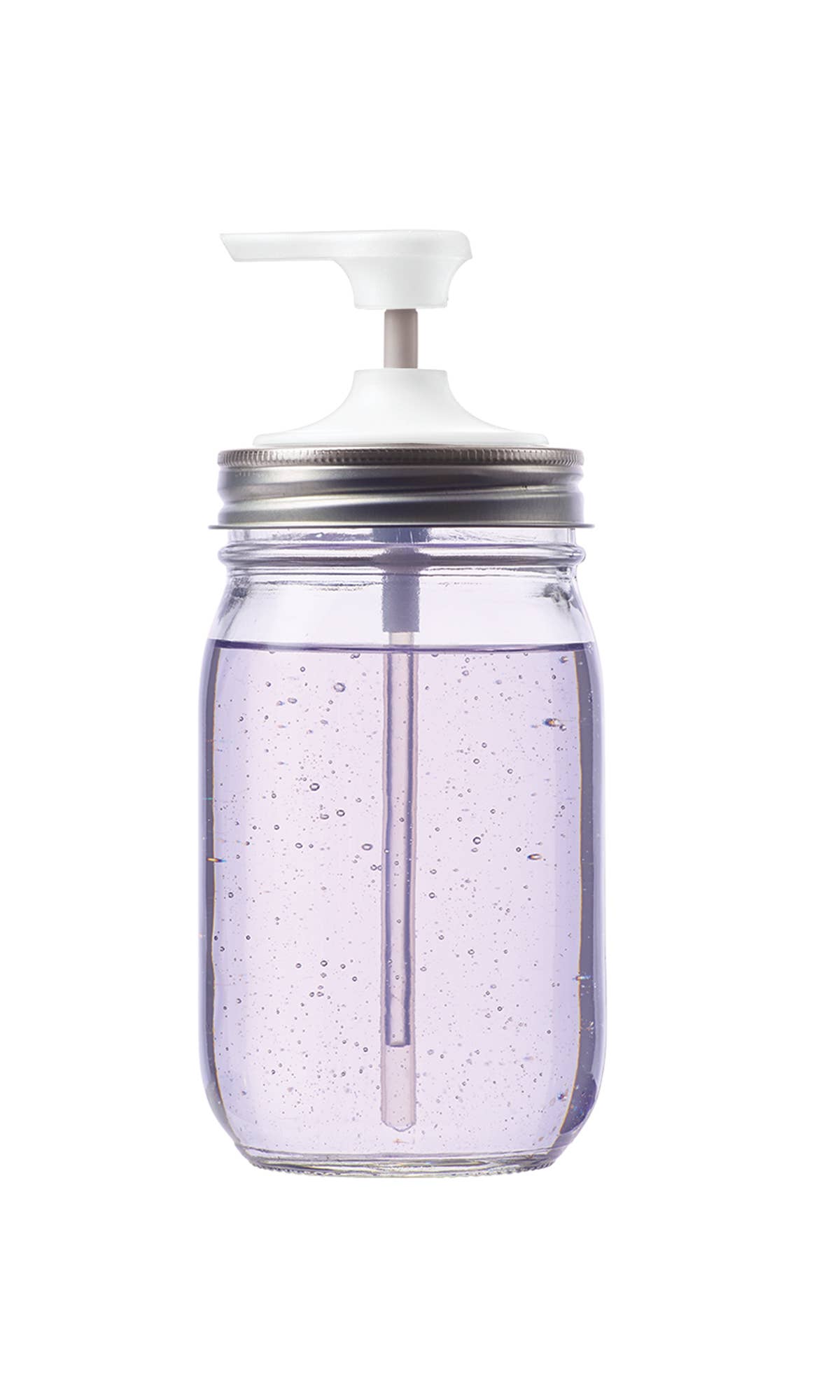 Clear mason jar with a white pump lid on a white background