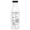 Clear bottle with black lid and label on a white background