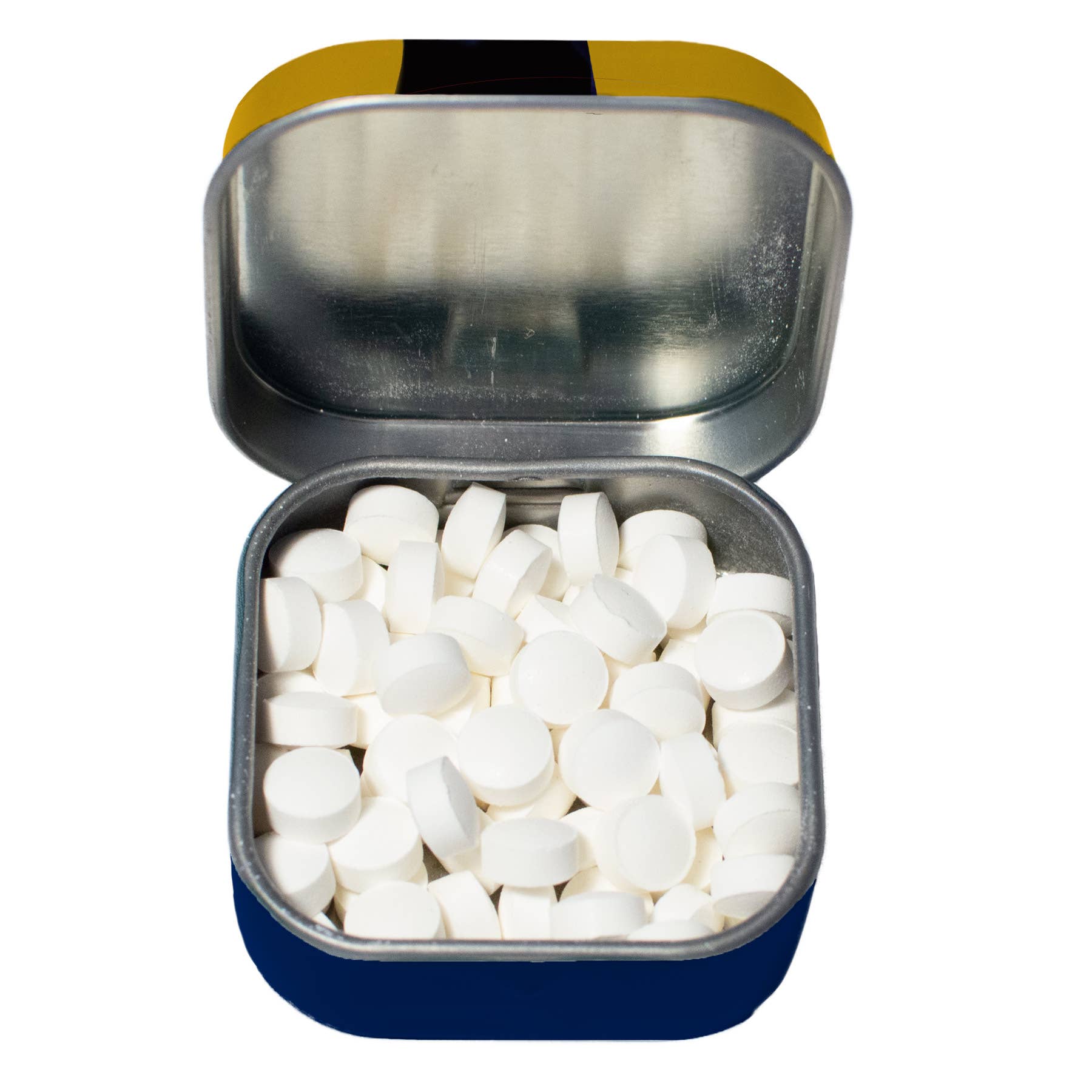 Open tin with white tablets on a white background
