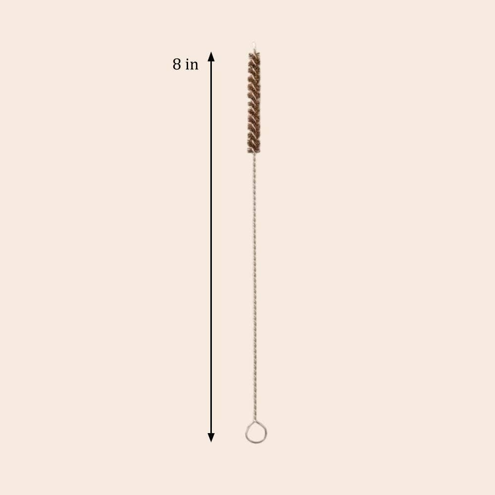 Cleaning brush with a chain on a beige background, labeled '8 in'.