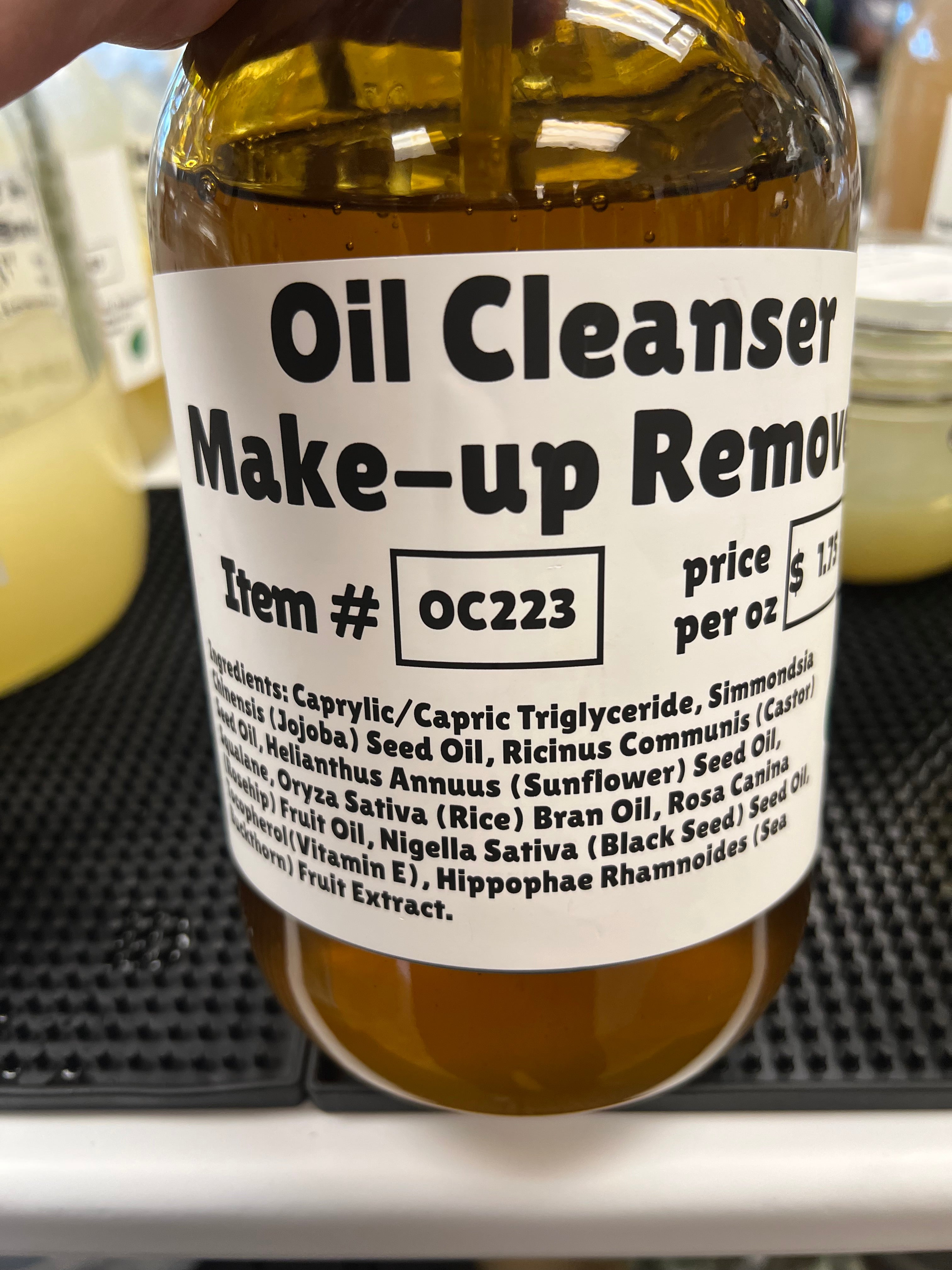 Make-up remover bottle with a label on a blurred background