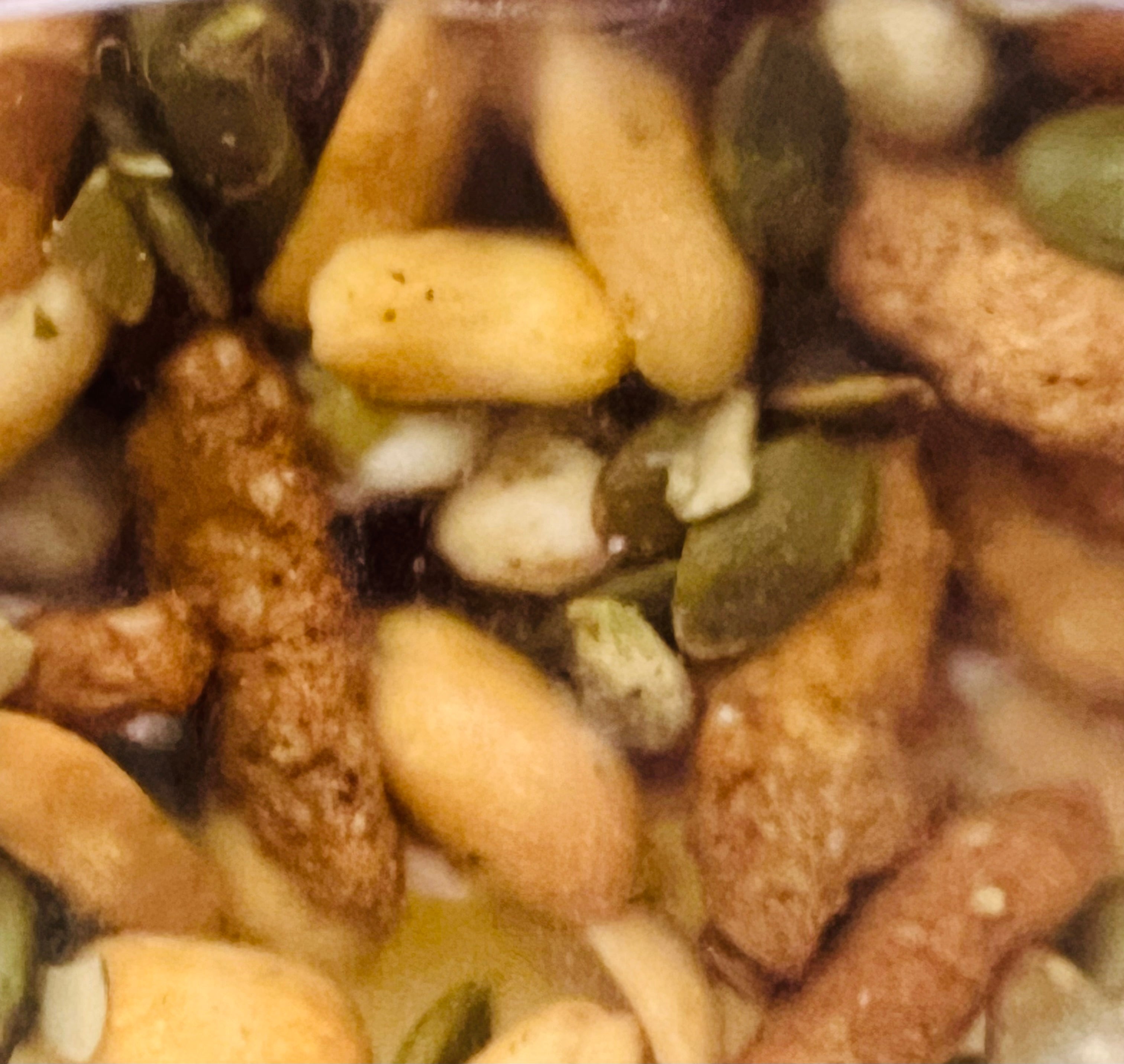 Close-up of a mix of nuts and seeds in a container