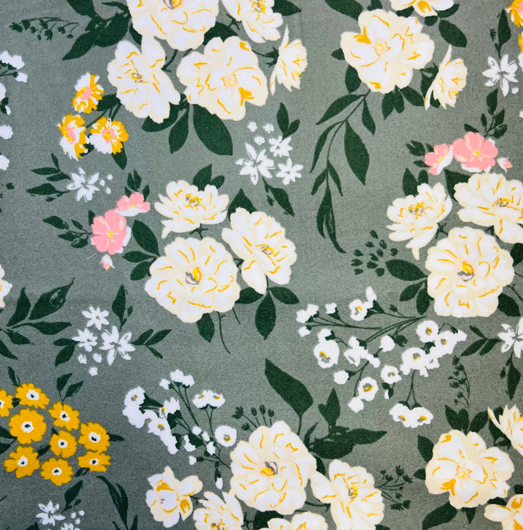 Floral pattern with white, yellow, and pink flowers on a gray background