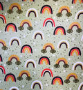 Pattern of colorful rainbows and clouds on a green background