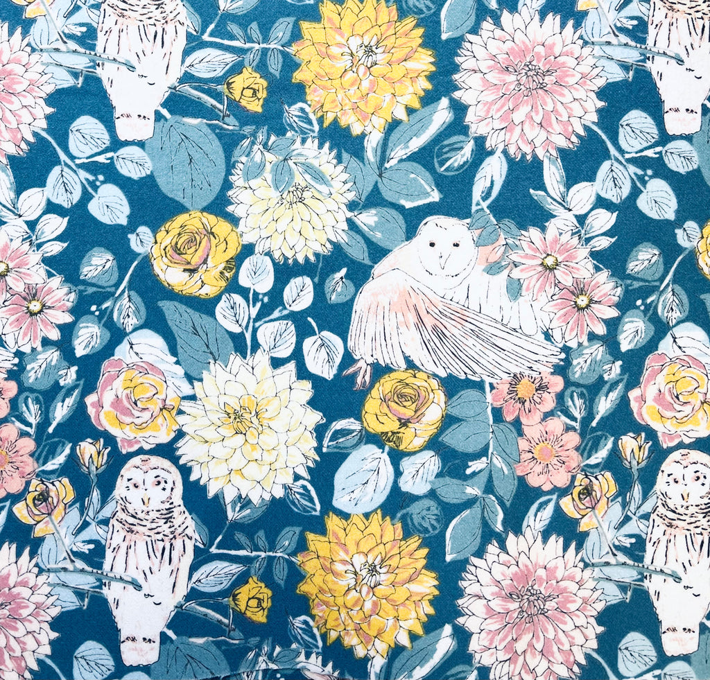 Floral and owl pattern on a blue background
