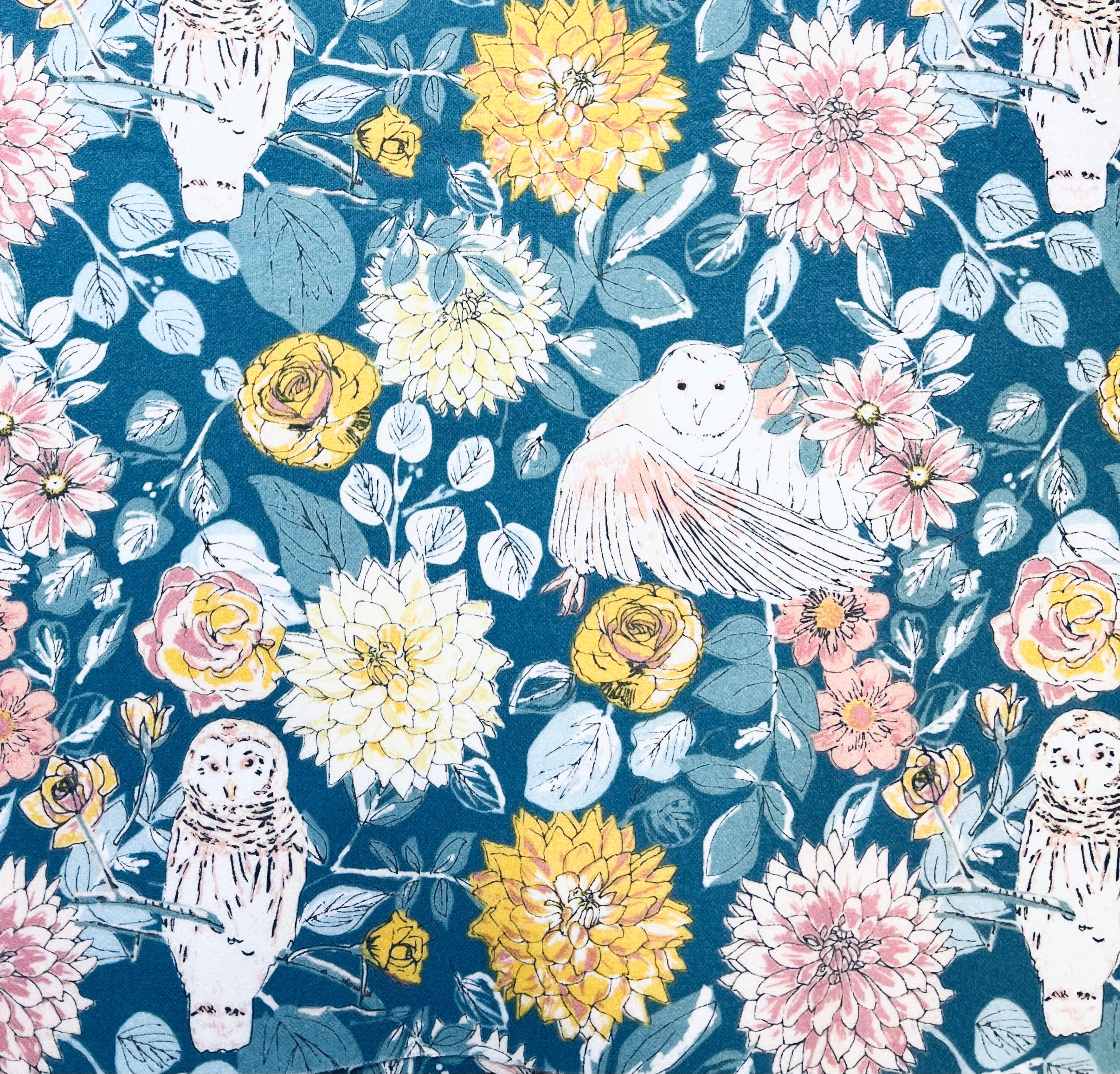 Floral and owl pattern on a blue background