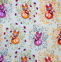 Pattern of cartoon foxes with colorful leaves on a light jade colored background