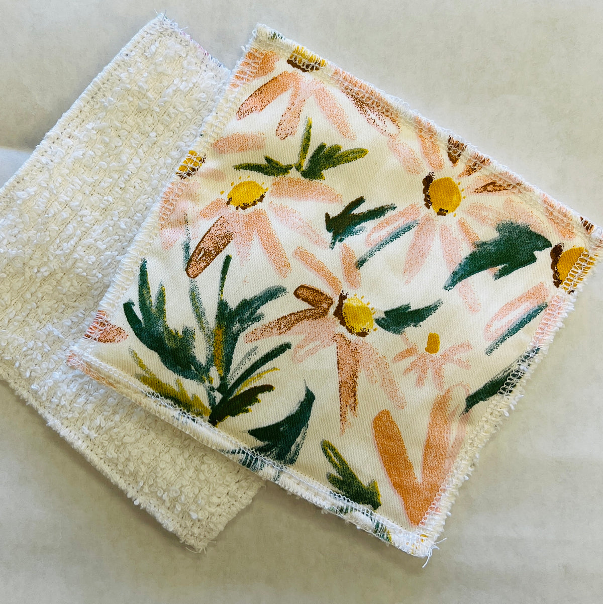 Pink flowers and greenery with white background fabric square sponge