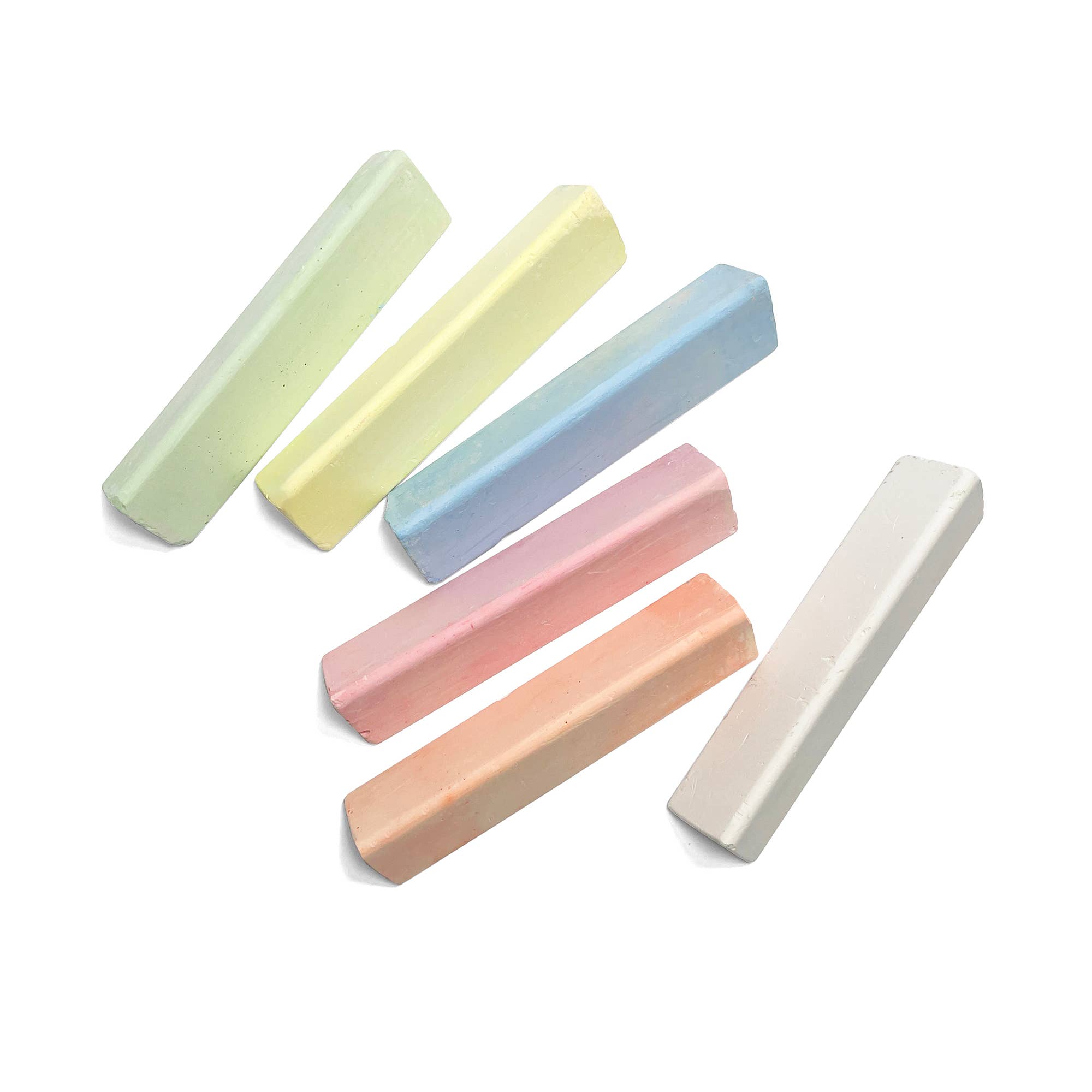 Set of pastel-colored chalk sticks on a white background