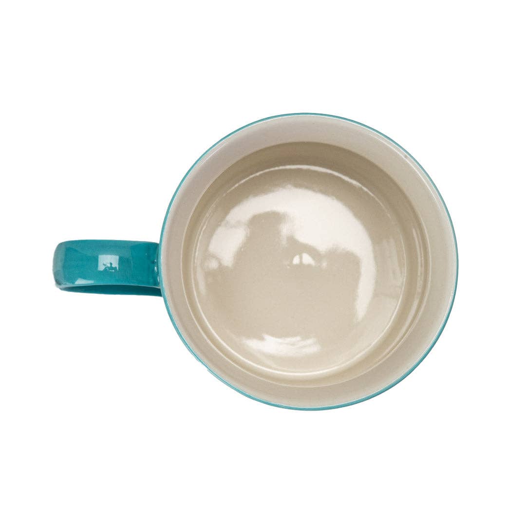 Mug with turquoise handle and rim on a white background