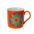 Orange mug with a colorful floral design on a white background