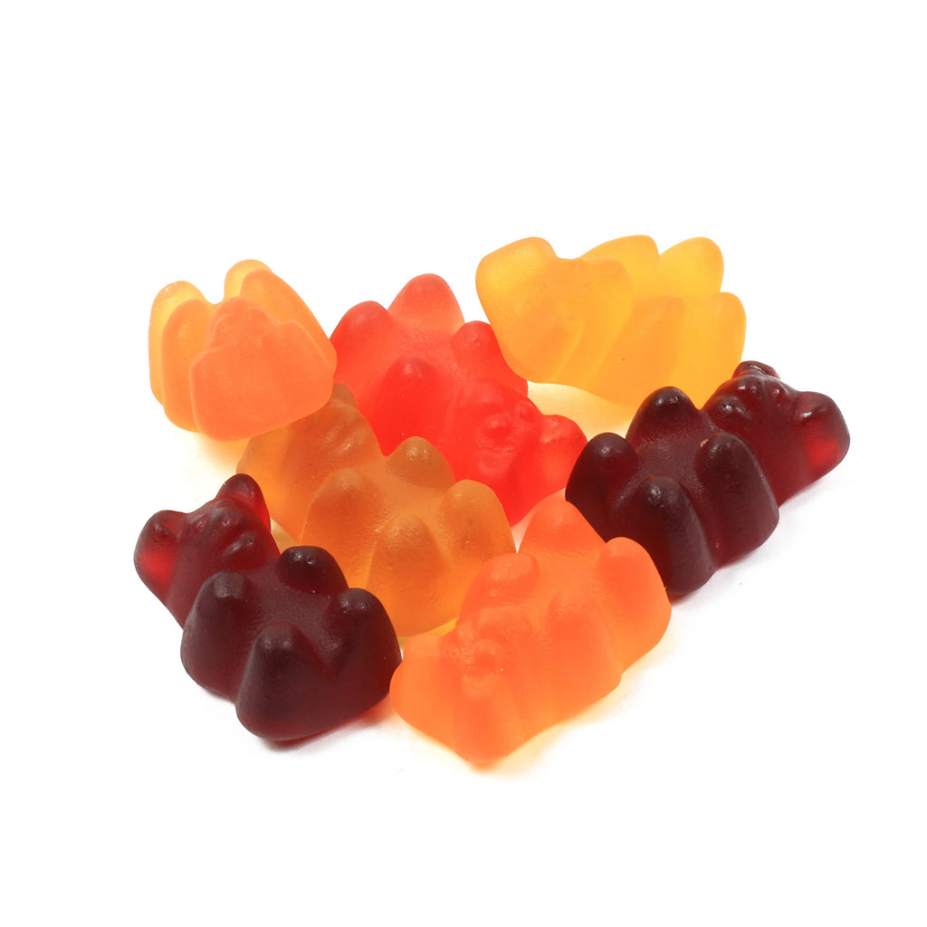 Colorful gummy bears arranged in a circular pattern on a white background