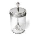 Clear glass jar with silver lid and handle on a white background