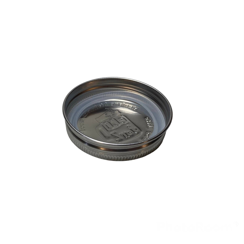 Metal jar lid on a white background