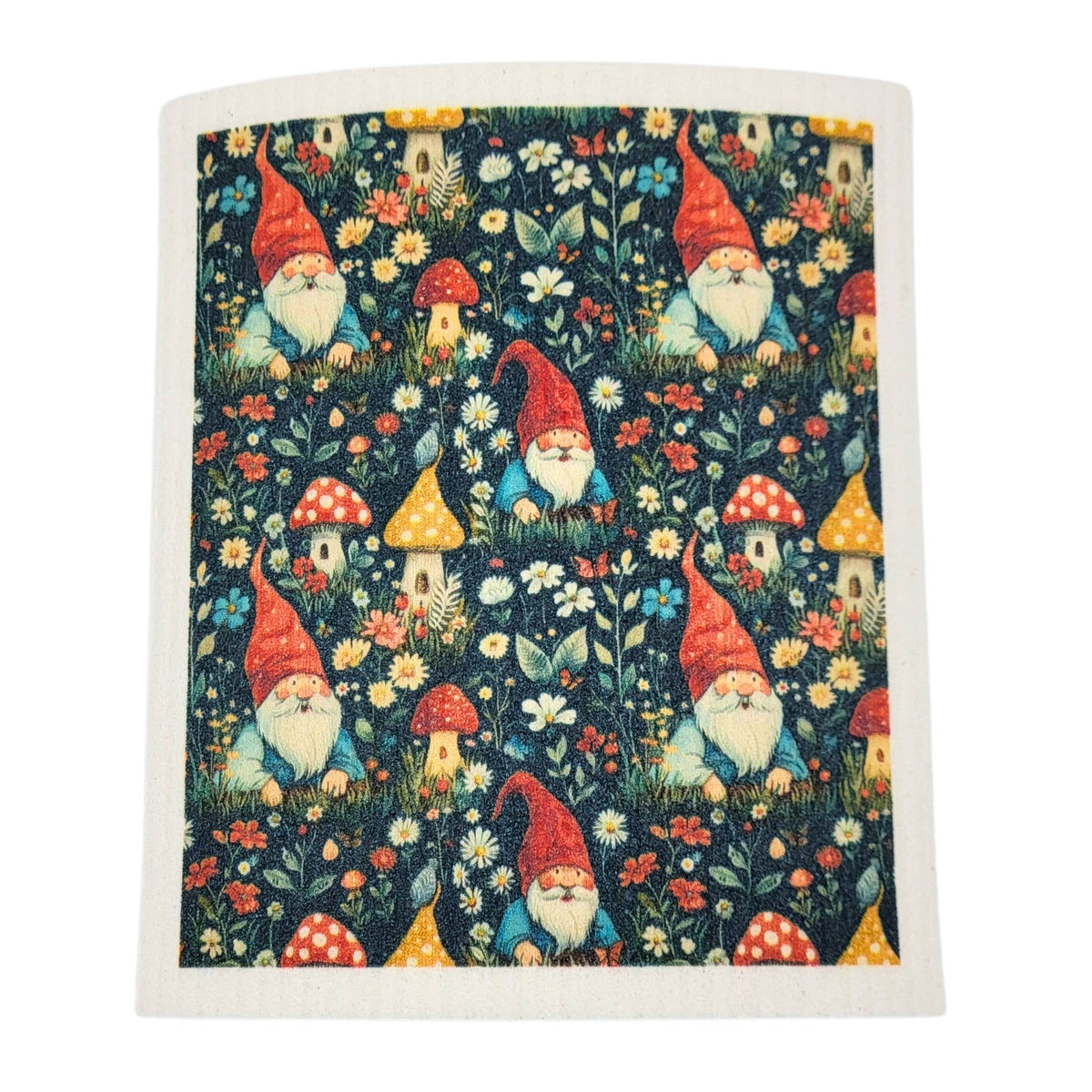 A square fabric item, likely a tea towel or napkin, featuring a whimsical garden gnome pattern on a dark navy background. The pattern includes red-hatted gnomes, red and yellow mushrooms, and small houses among white and yellow flowers.