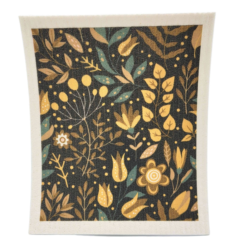 Floral patterned towel with yellow and green leaves on a dark background