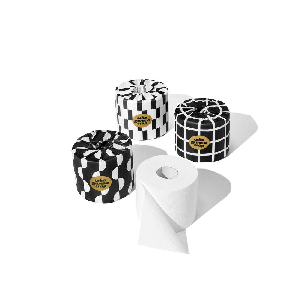 Three black and white patterned containers with gold labels on a white background