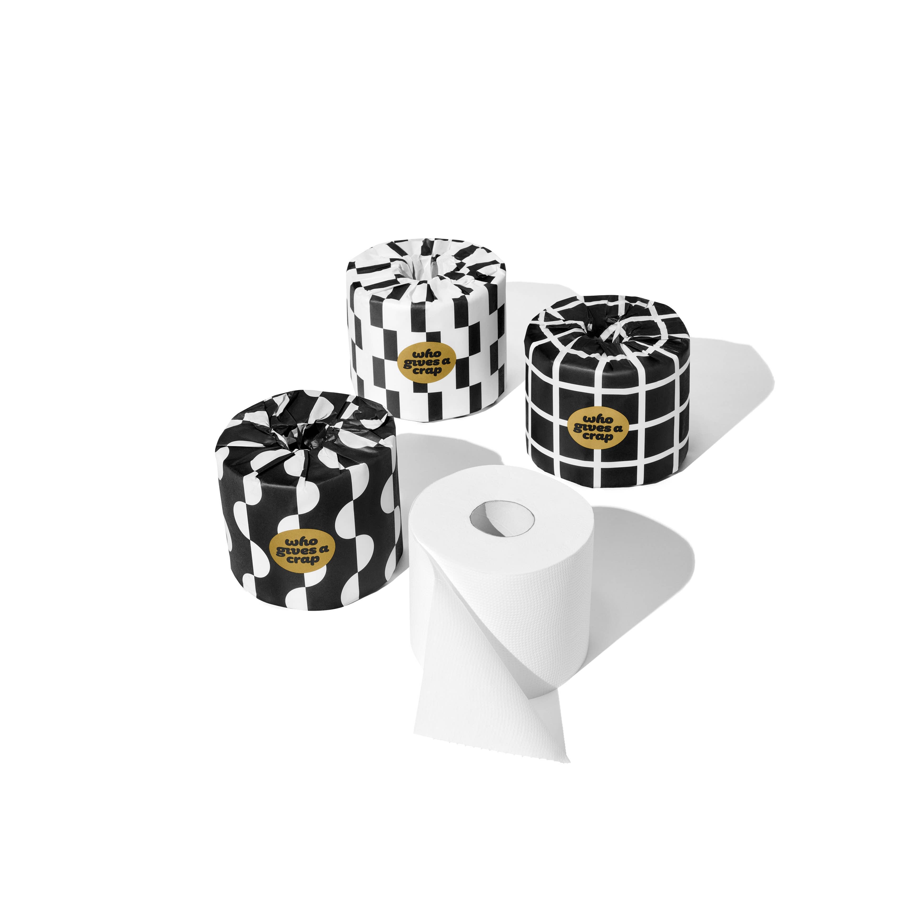Three black and white patterned containers with gold labels on a white background