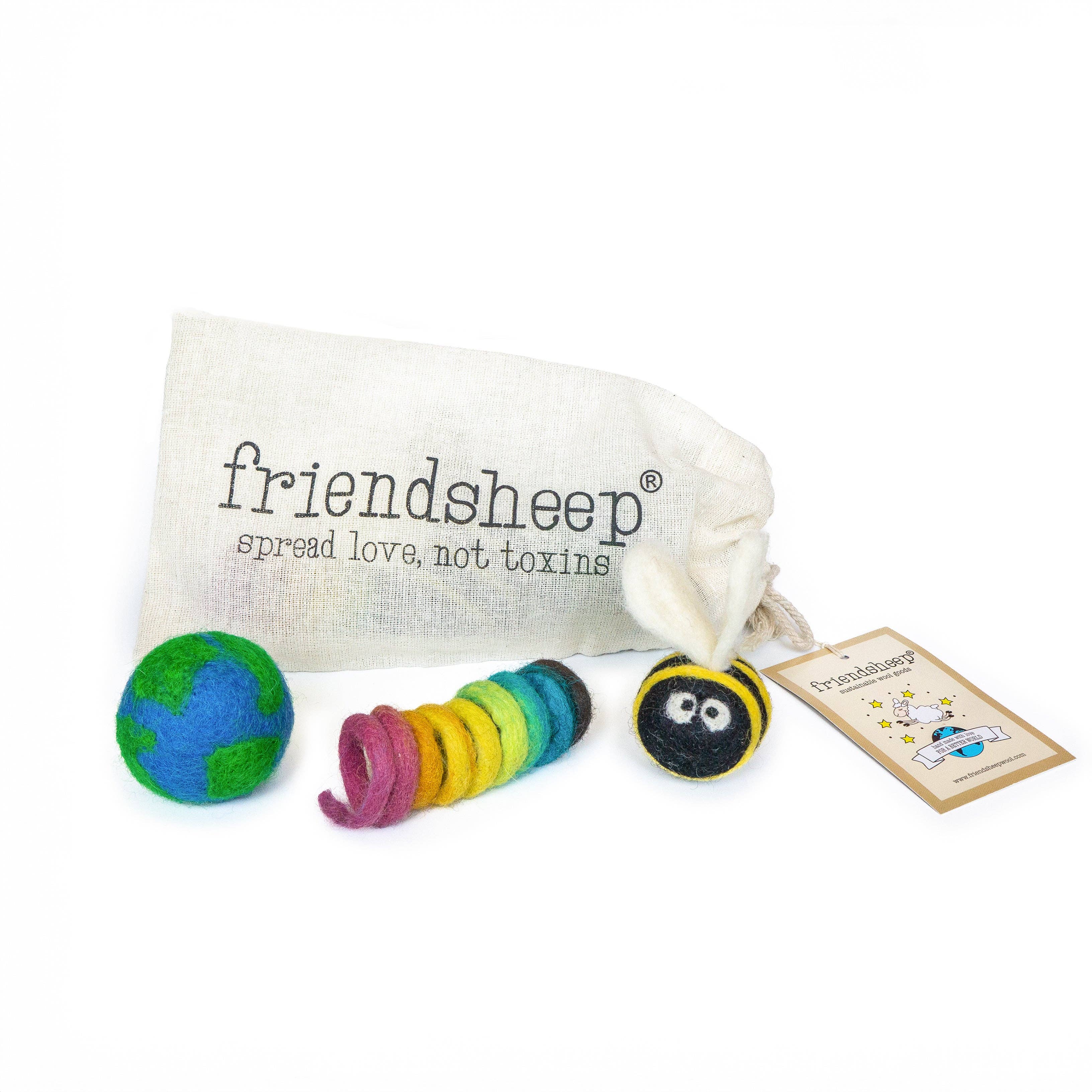 Colorful toys and a drawstring bag with 'friendsheep' branding on a white background.