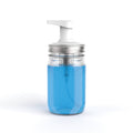 Clear container with blue liquid and a white pump on a white background
